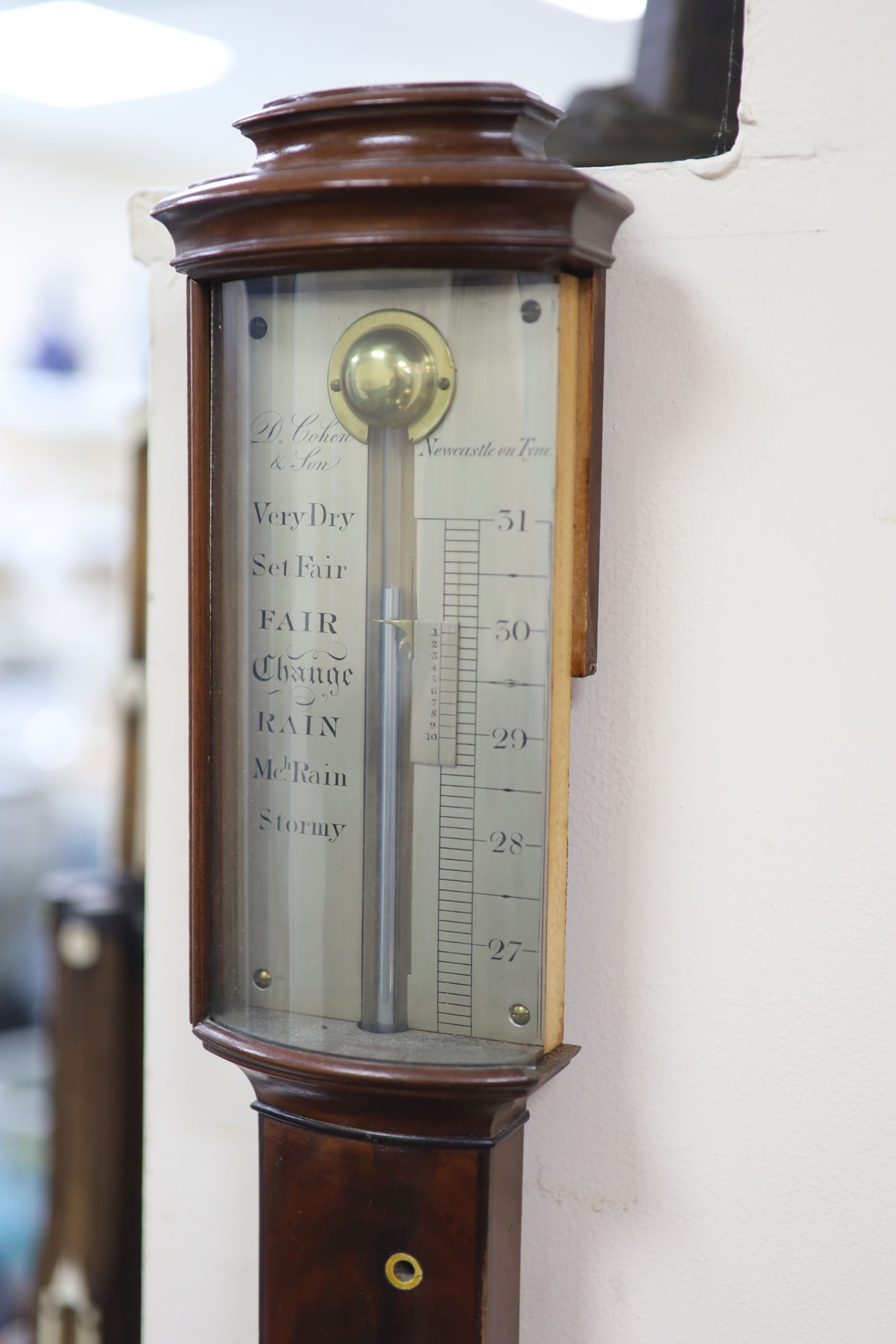 A George III mahogany bow front stick barometer, by D. Cohen & Son, Newcastle upon Tyne H 95cm.